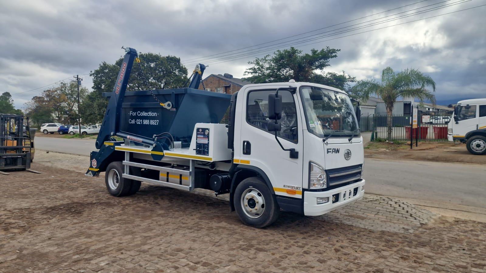 West Coast Skips hook-lift truck carrying a specialist skip